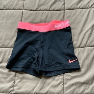 Black and coral Nike Pro shorts